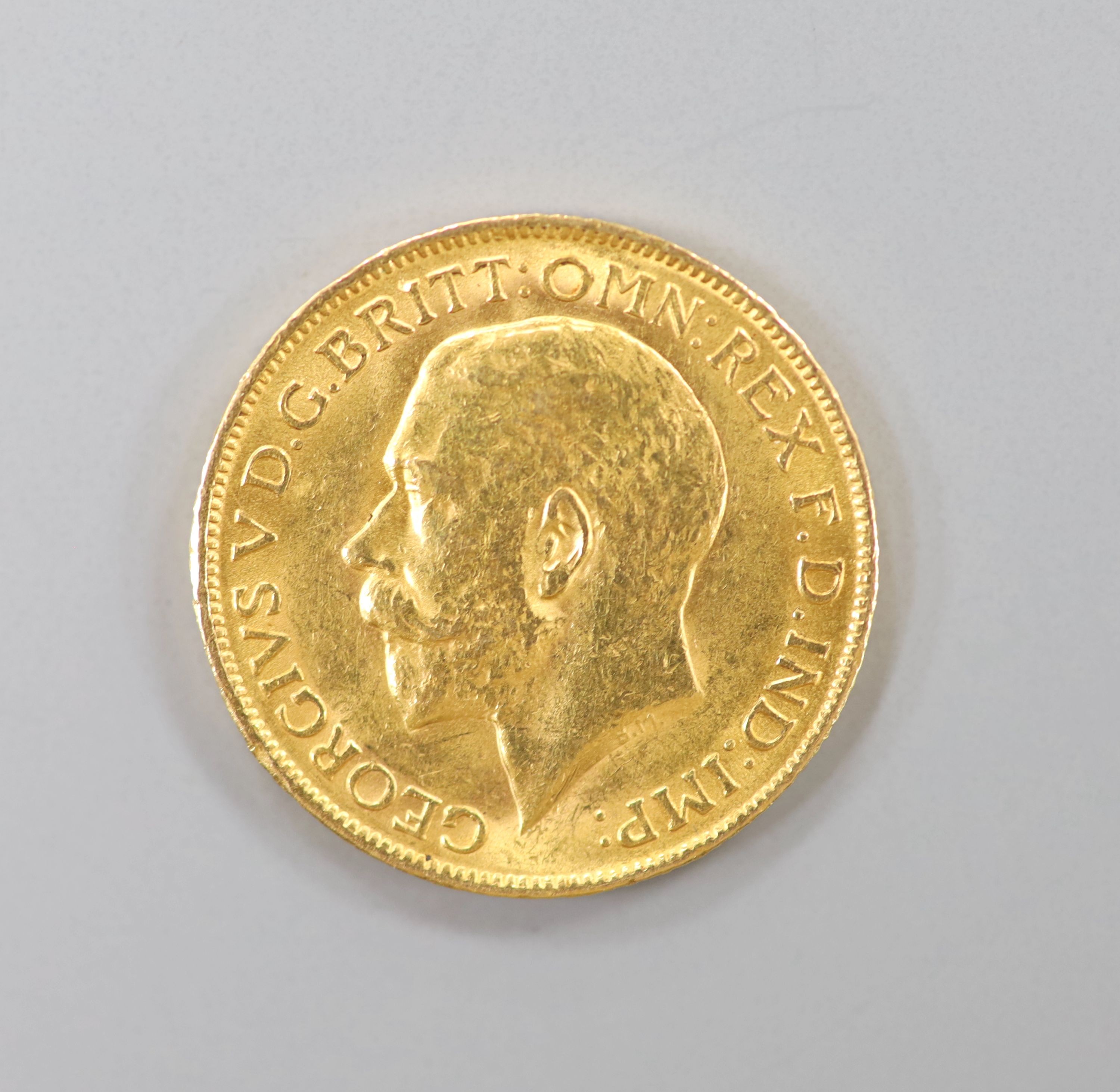 A George V 1911 gold sovereign.